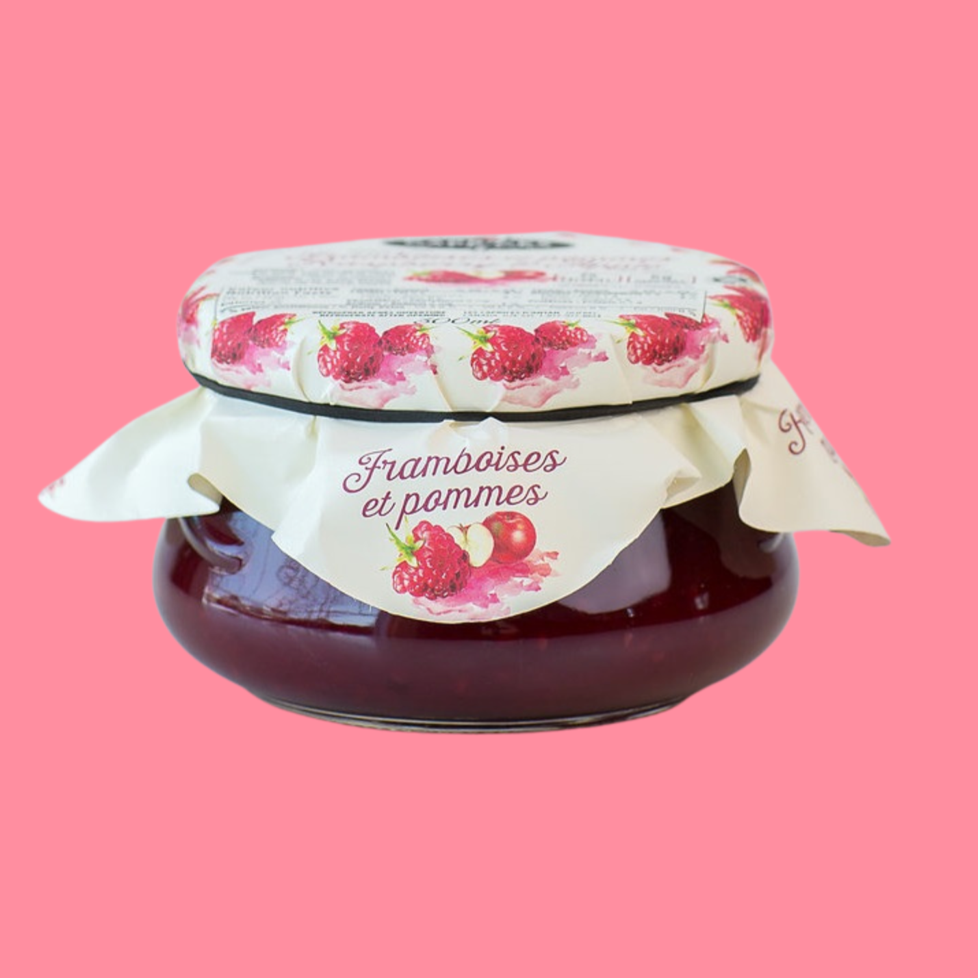 Pot de tartinade framboises et pommes de la marque Caprices d’Antan. Confiture artisanale dans un pot en verre avec un couvercle décoré d’illustrations de framboises. Produit québécois naturel, parfait pour les toasts, desserts et pâtisseries.