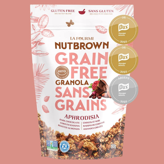 Emballage de granola sans grains Nutbrown de La Fourmi, saveur Aphrodisia (chocolat noir, raisins de Corinthe, amandes grillées). Sac refermable de 180 g, certifié sans gluten, keto et sans OGM. Produit québécois primé aux DUX 2025 pour une alimentation saine, idéal pour un déjeuner nutritif ou une collation gourmande.