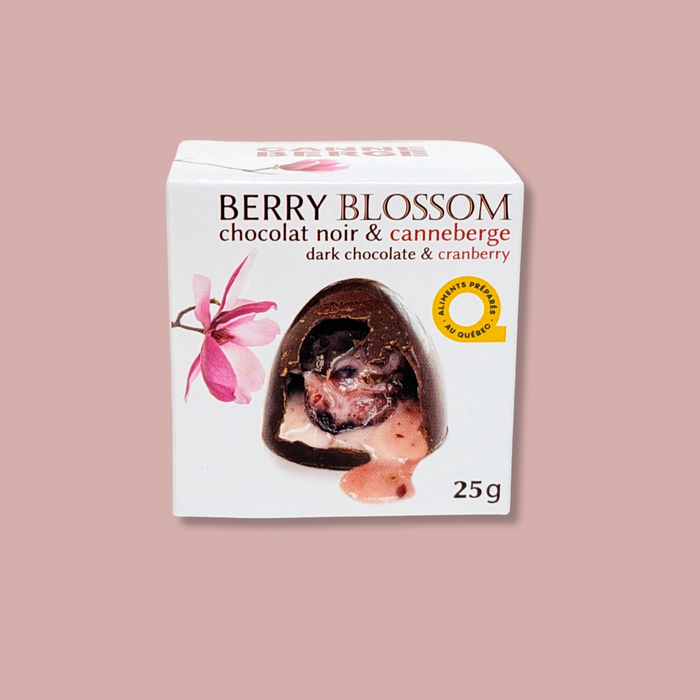 Boîte de chocolats Berry Blossom de Nutra-Fruit, chocolat noir fourré à la canneberge. Format 25 g. Produit québécois gourmand, alliant le goût riche du chocolat noir à l’acidité des canneberges, idéal pour une collation ou un cadeau raffiné.