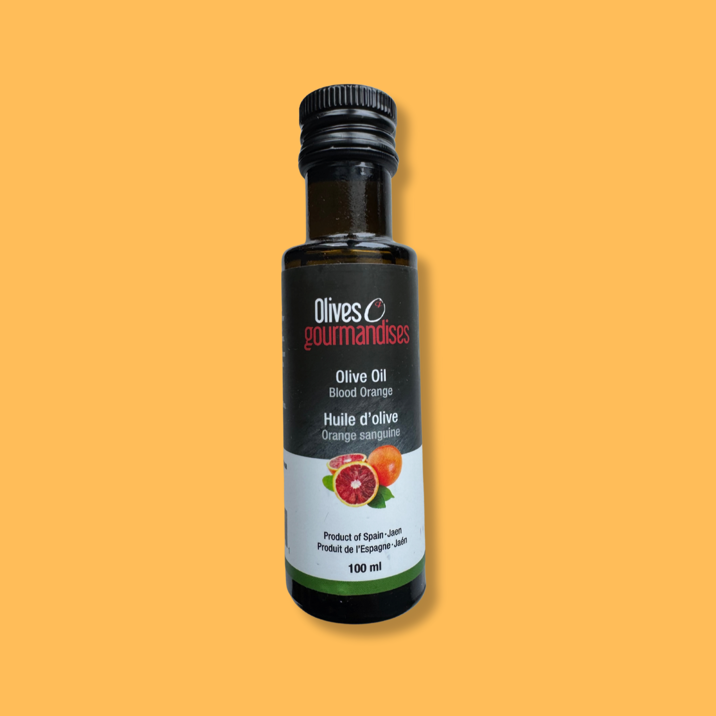 Bouteille de 100 ml d'huile d'olive à l'orange sanguine de la marque Olives et Gourmandises. Produit artisanal issu d'olives de Jaén, Espagne. Parfait pour sublimer salades, poissons et desserts avec une touche d'agrume.