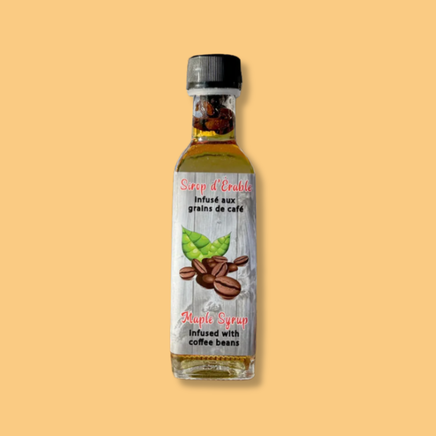 Petite bouteille de sirop d’érable infusé aux grains de café par Sucrerie 66 Brix. L’étiquette en bois vieilli met en avant une illustration de grains de café et une feuille d’érable. Un mariage parfait entre la douceur de l’érable et l’intensité du café pour une touche gourmande et raffinée.